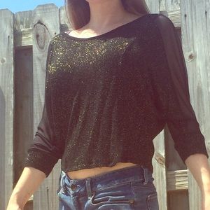 Cute black and gold top with sheer sexy sleeves